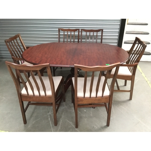 Stag extendable dining table with six chairs including two carvers