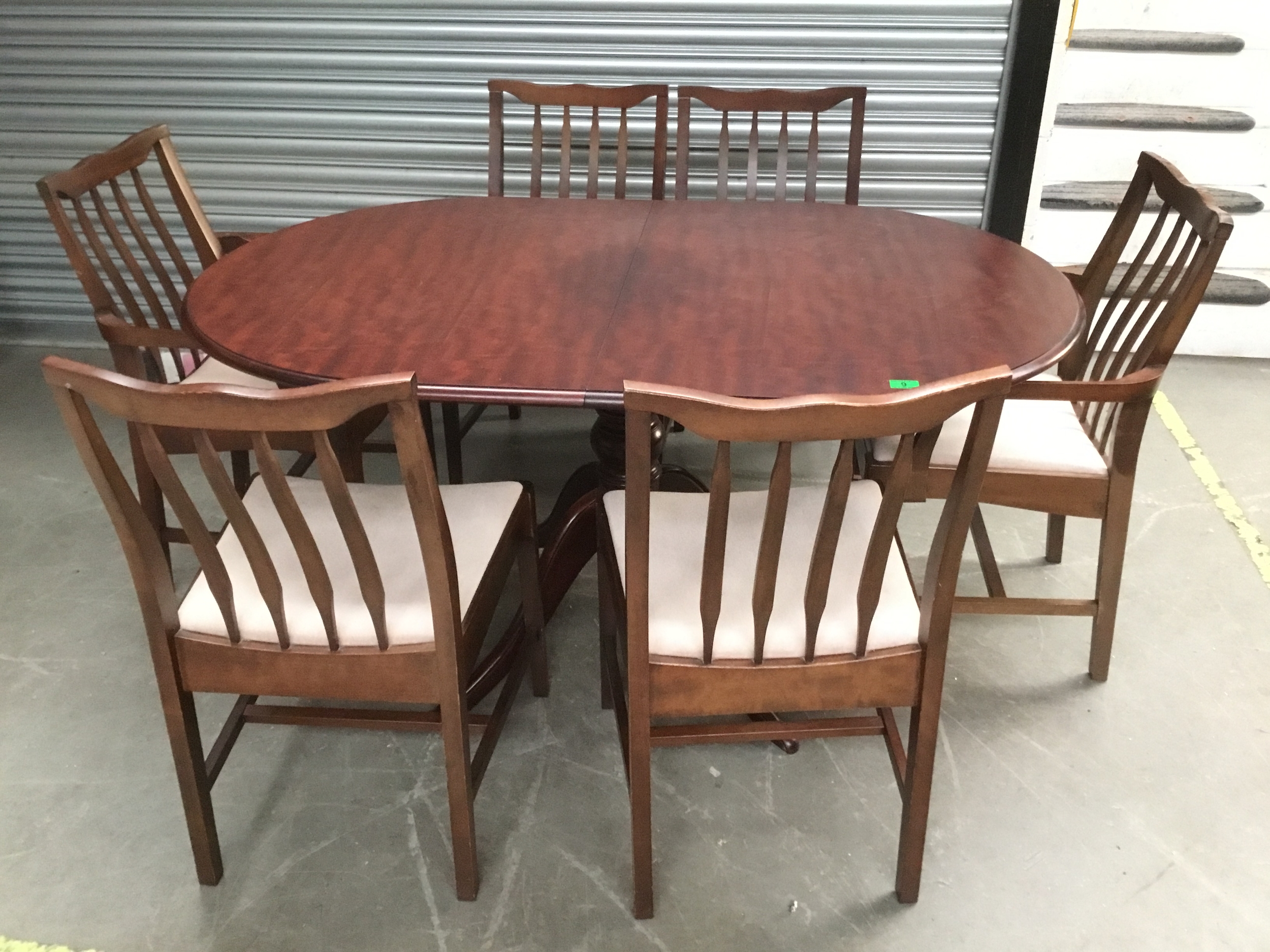 Stag extendable dining table with six chairs including two carvers