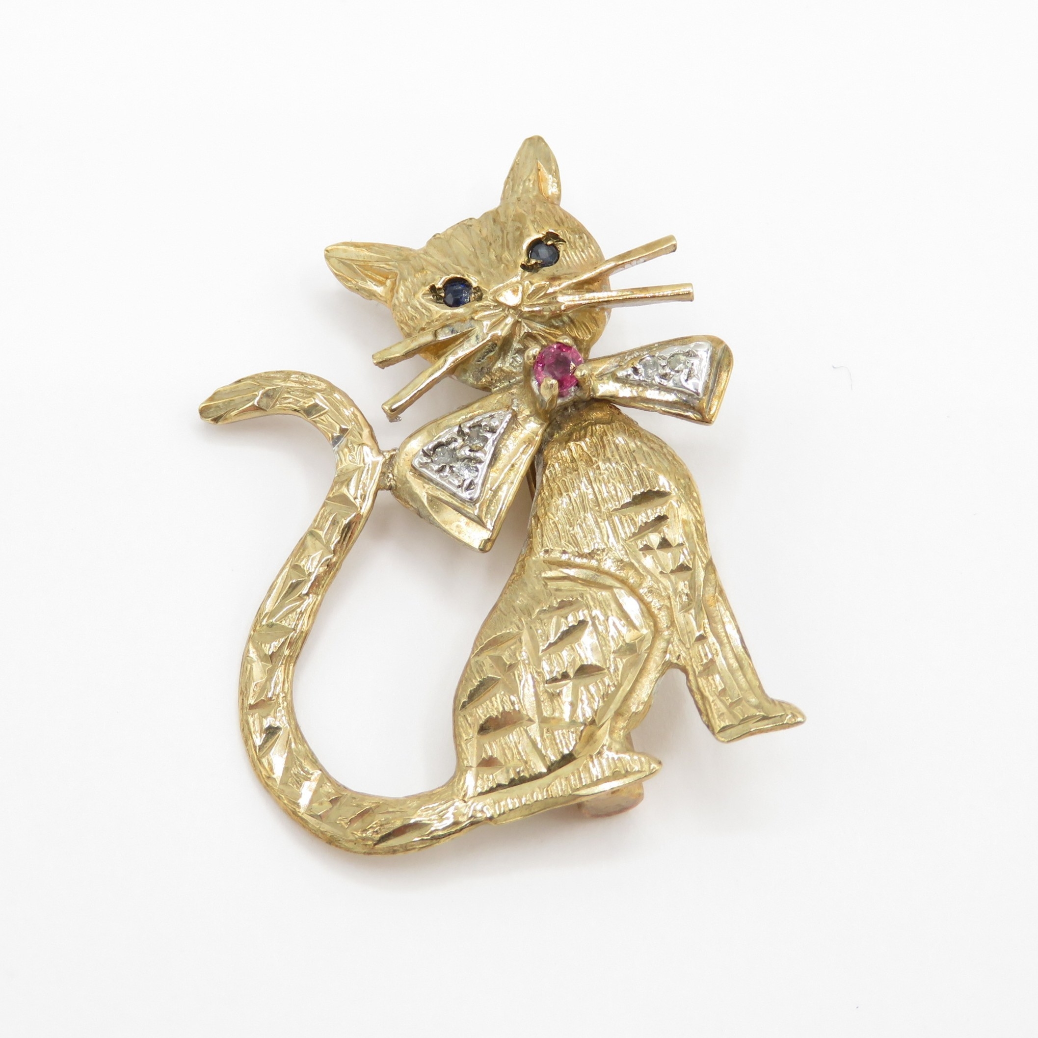 Vintage 9ct gold cat brooch set with sapphire, ruby and diamond accents