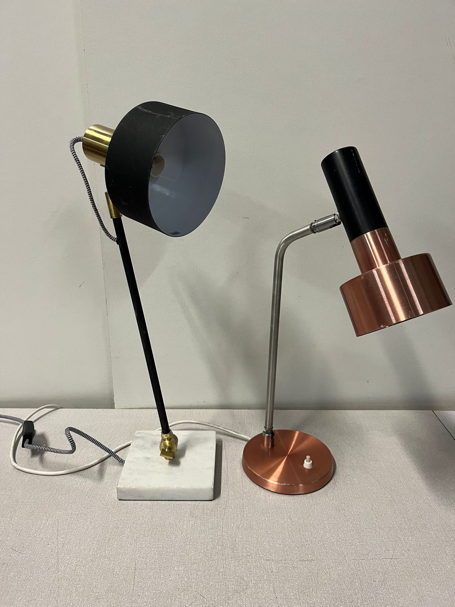 Possible Oriel Ari desk lamp with a second modern desk lamp on a marble base