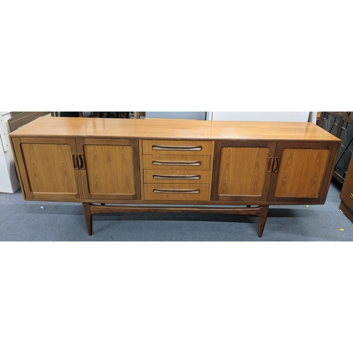 Long G-Plan Fresco teak sideboard with central drawers and cupboard doors designed by Victor Wilkins