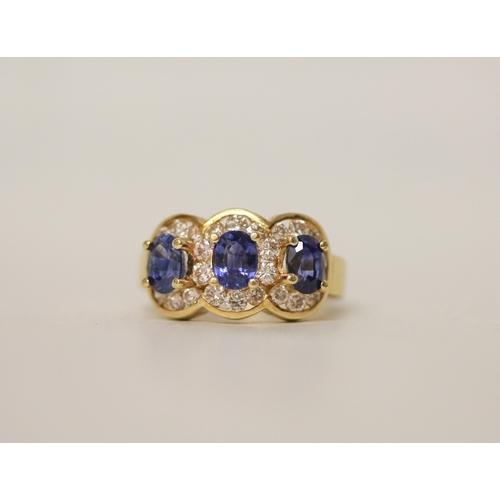 Modern 18ct sapphire and diamond triple cluster ring