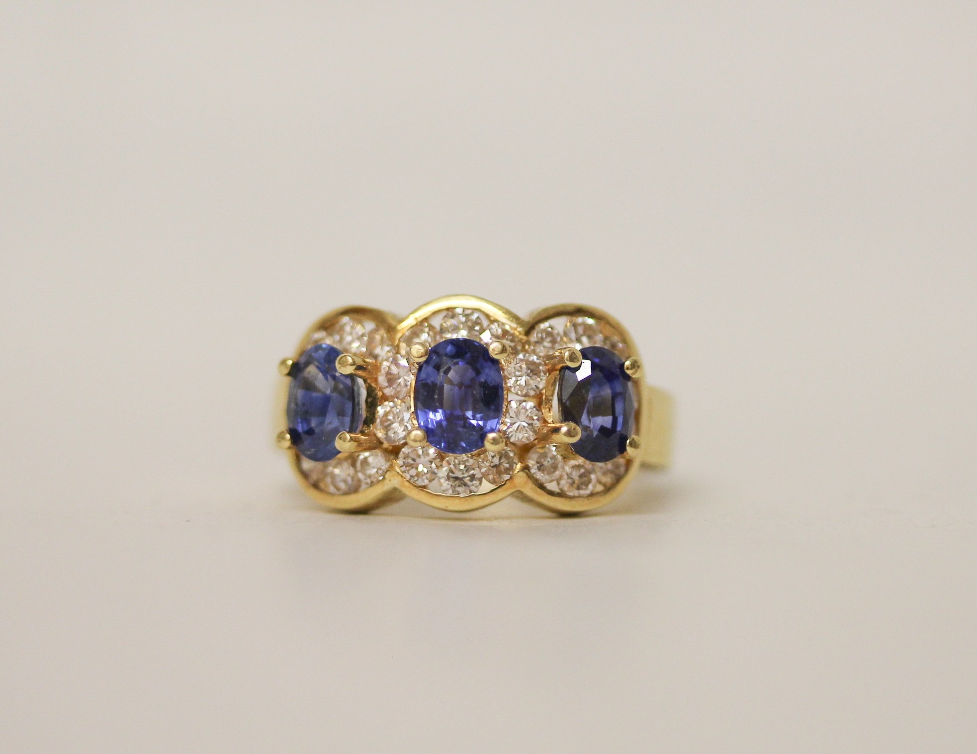 Modern 18ct sapphire and diamond triple cluster ring