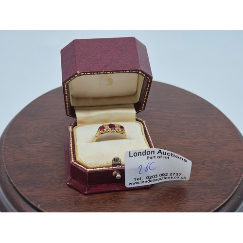 Victorian-style ruby and diamond three-stone ring with engraved yellow gold mount