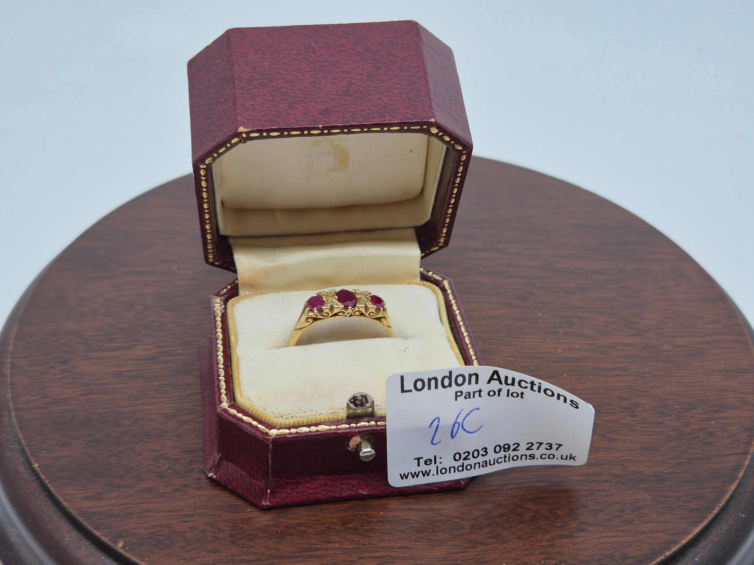 Victorian-style ruby and diamond three-stone ring with engraved yellow gold mount