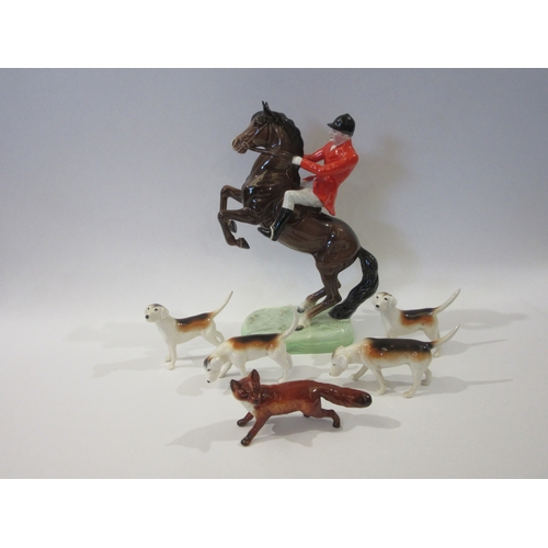 Beswick huntsman on rearing horse with four foxhounds and a fox in gloss finish