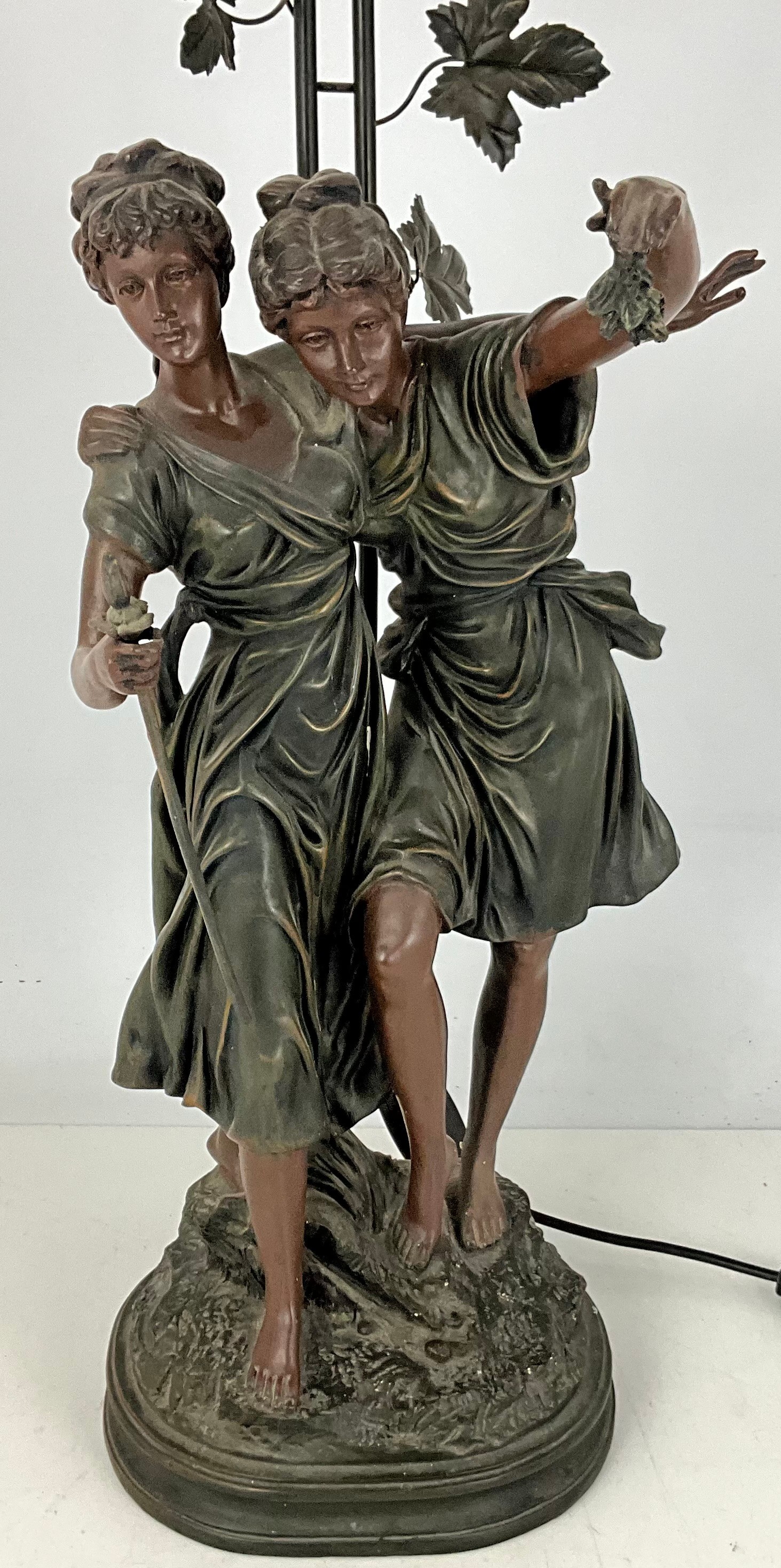 Large Widdop Bingham & Co Tiffany-style figurine lamp with stained-glass-effect shade and two female figures forming the base