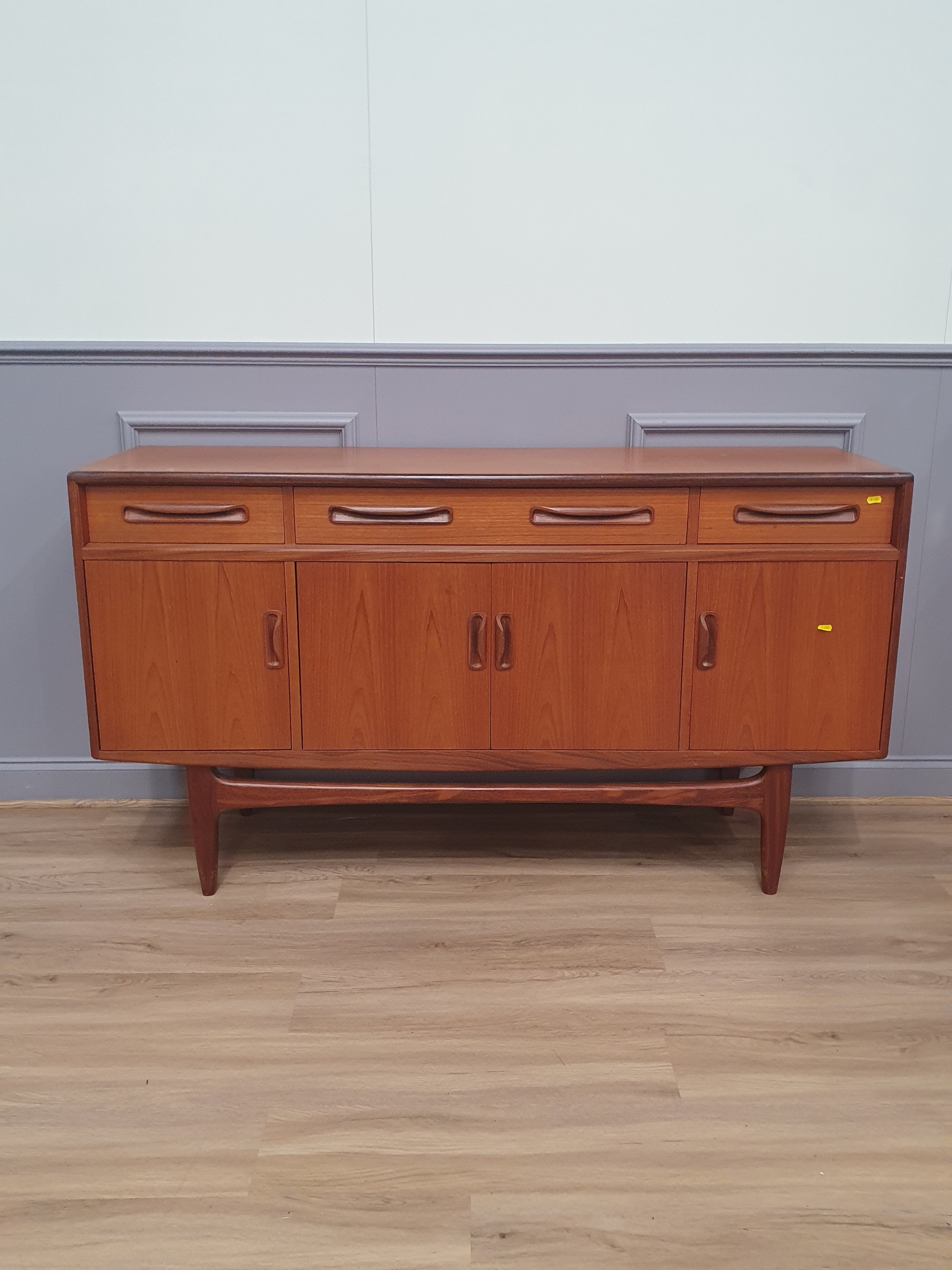 G-Plan teak sideboard with four drawers above four cupboard doors