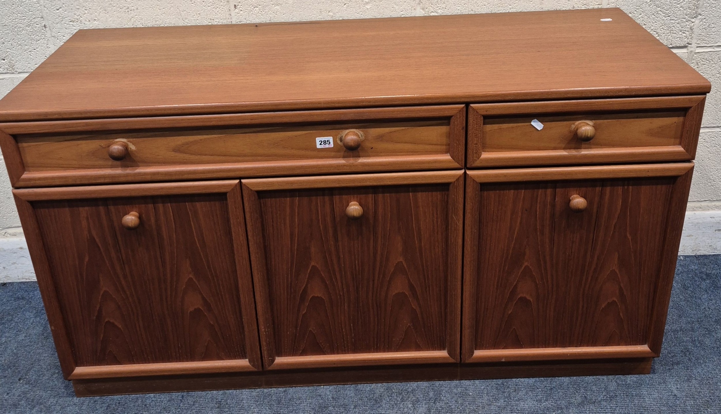 G Plan mid-century teak sideboard with two drawers above three cupboard doors