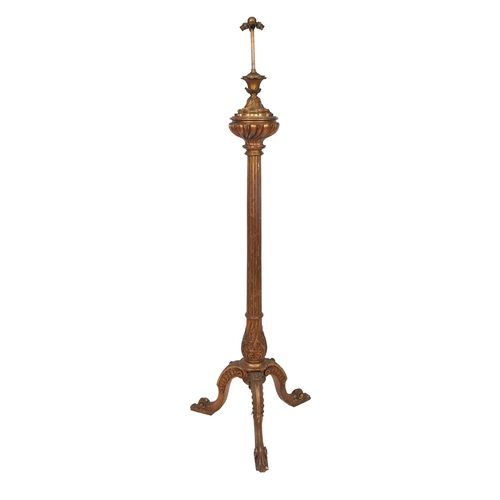 Late 19th-century carved giltwood standard lamp with fluted column, acanthus-carved capital, and triform scrolling base