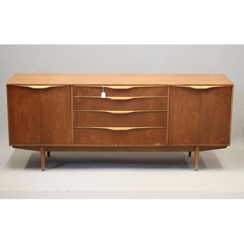 Mid-century teak sideboard by Sutcliffe of Todmorden with four central drawers, paired cupboards, lip handles, and tapering legs
