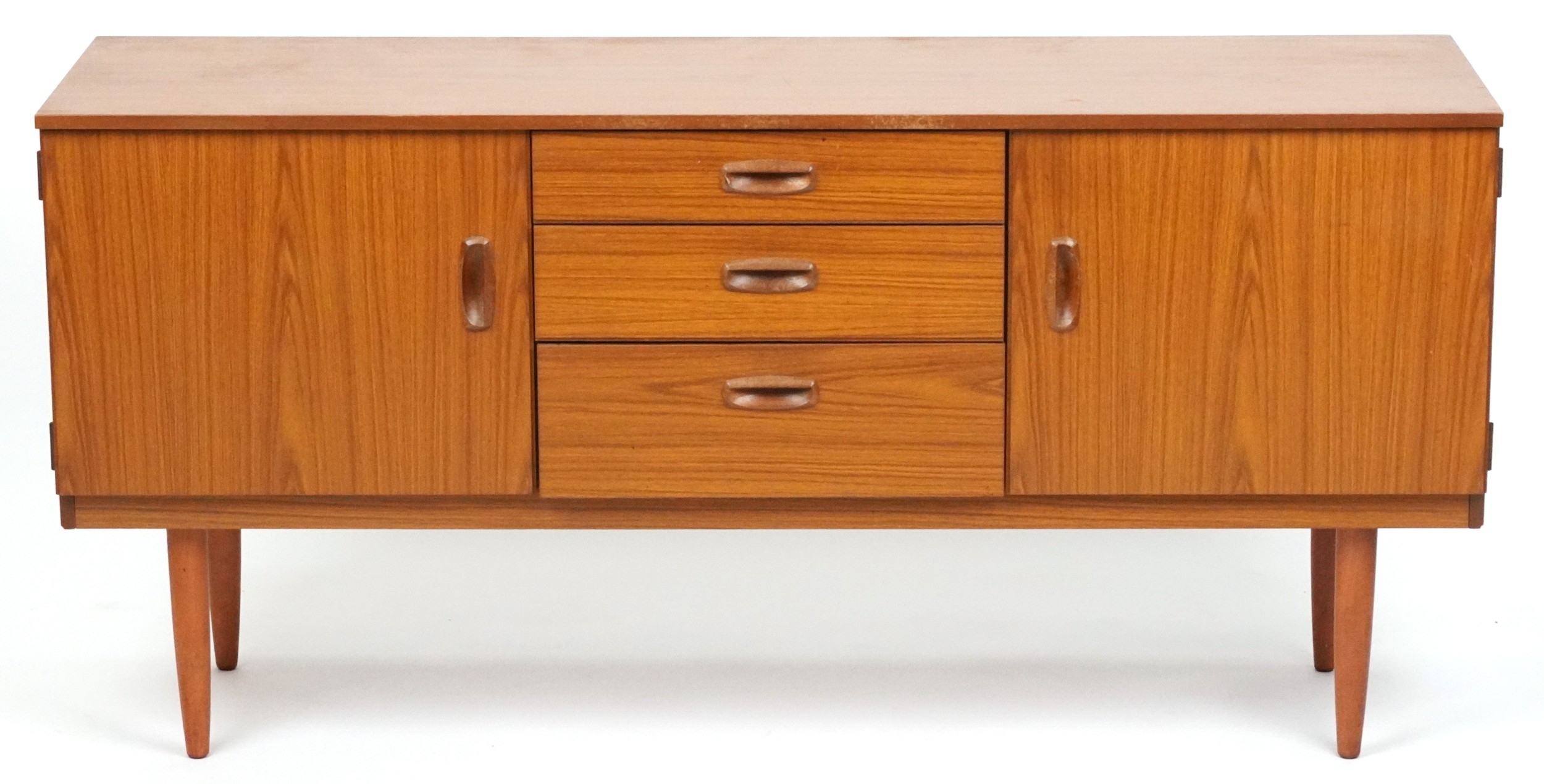 Mid-century Schreiber teak sideboard with three central drawers, paired cupboard doors, and tapering legs