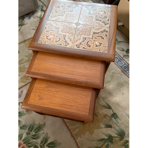 Nest of three mid-century G Plan Astro teak coffee tables with inset tile tops