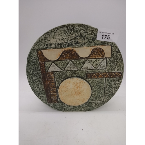 Troika pottery wheel vase with moulded geometric decoration on a textured green ground