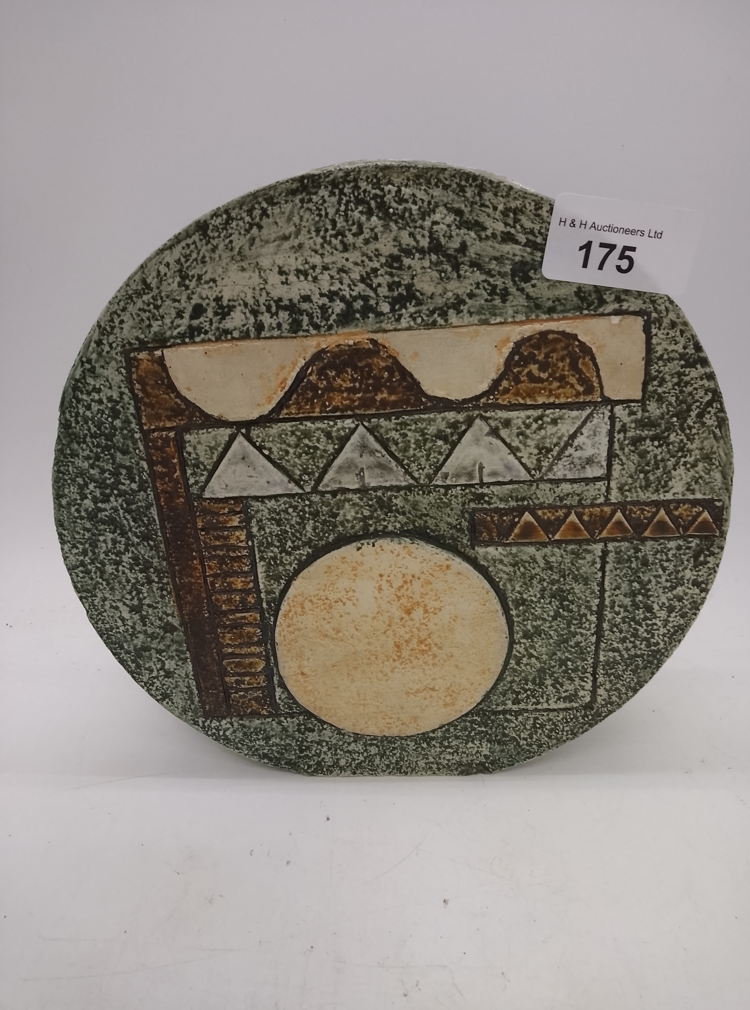 Troika pottery wheel vase with moulded geometric decoration on a textured green ground
