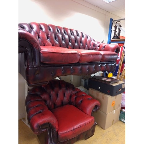 Chesterfield three-piece suite with a three-seater sofa and matching armchair in red buttoned upholstery