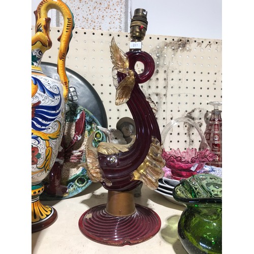 Ruby Murano glass sculptural table lamp with curled body, applied amber glass fish and fin details, and an older brass lamp fitting