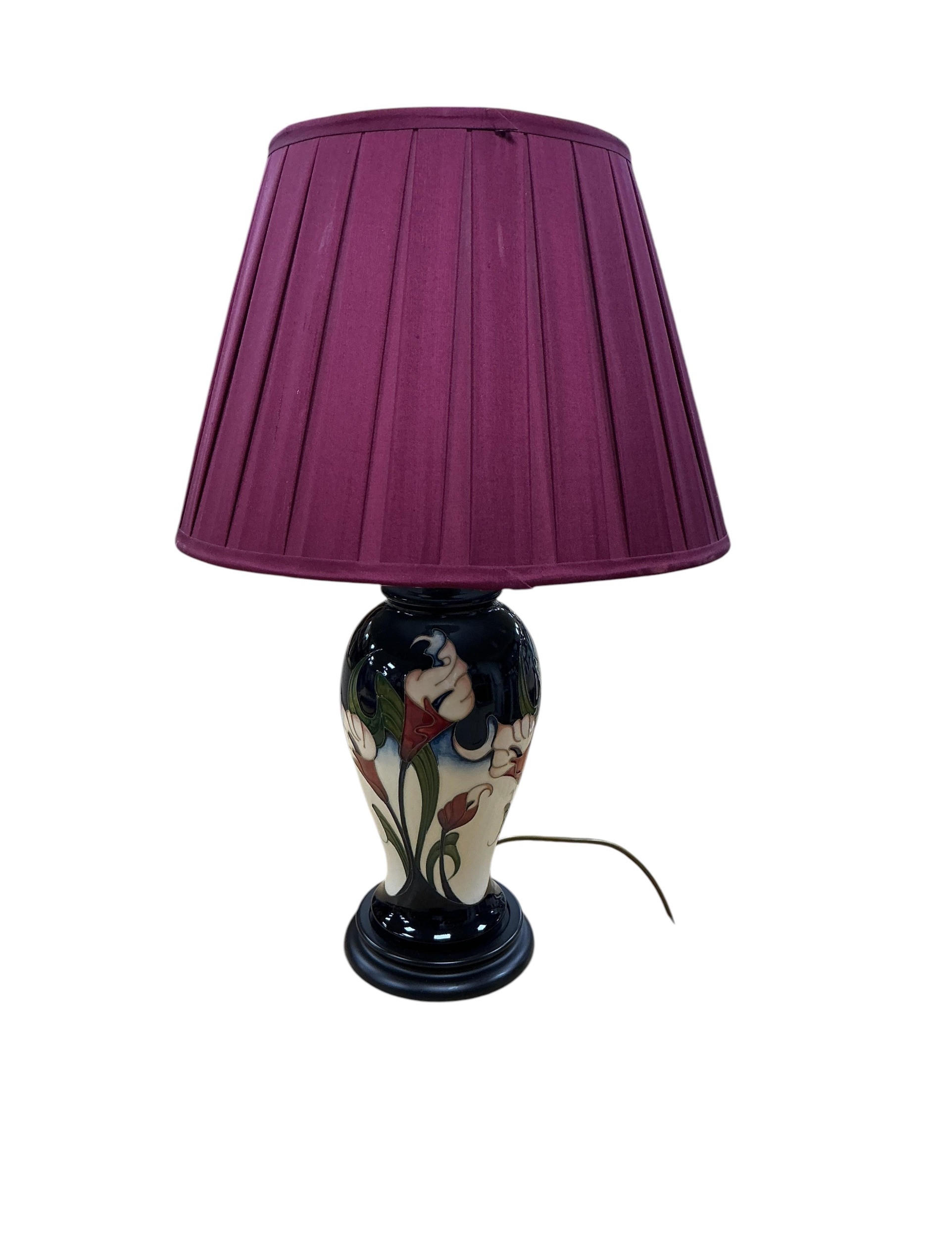 Moorcroft Calla Lily pattern table lamp with cream pleated shade and tube-lined white flowers rising over a blue-green ground