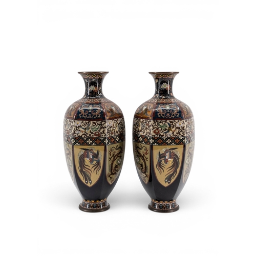 Pair of Japanese Meiji cloisonn&eacute; vases with black grounds, cream figural panels, ho-o birds, dragons, and geometric border bands
