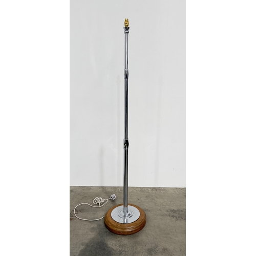Art Deco chrome standard lamp with stepped cylindrical pillar, faceted diamond-shaped junctions, and a round oak base