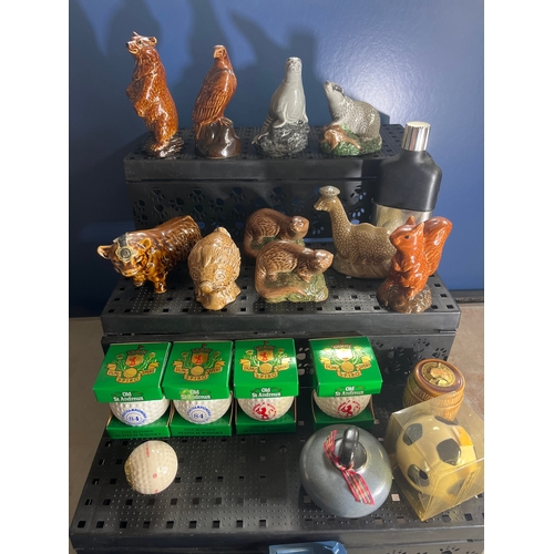 Collection of Beneagles and Old St Andrews ceramic Scotch whisky miniature decanters including animal-form bottles, golf-ball miniatures, and other Scottish souvenir whisky shapes