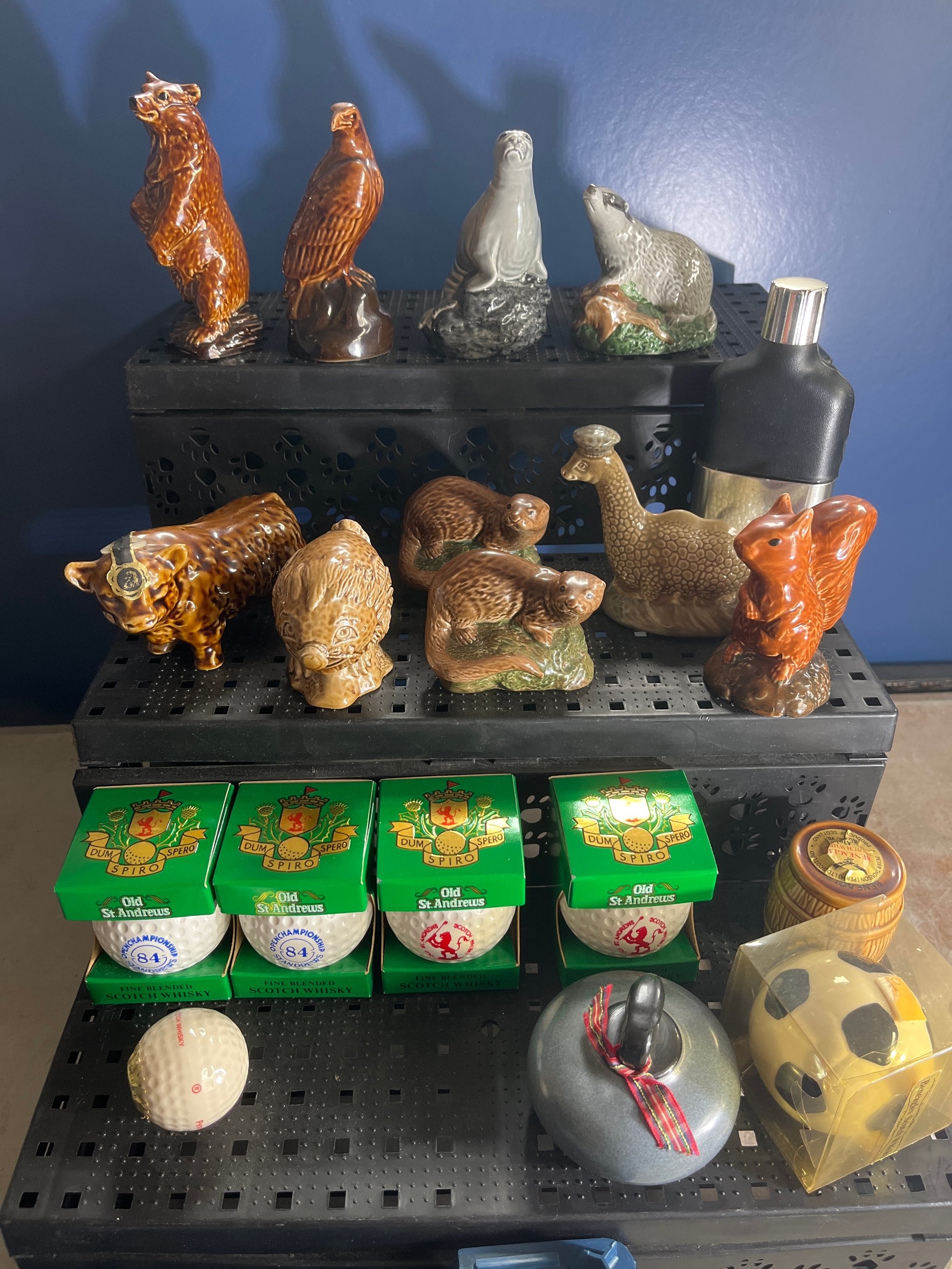 Collection of Beneagles and Old St Andrews ceramic Scotch whisky miniature decanters including animal-form bottles, golf-ball miniatures, and other Scottish souvenir whisky shapes