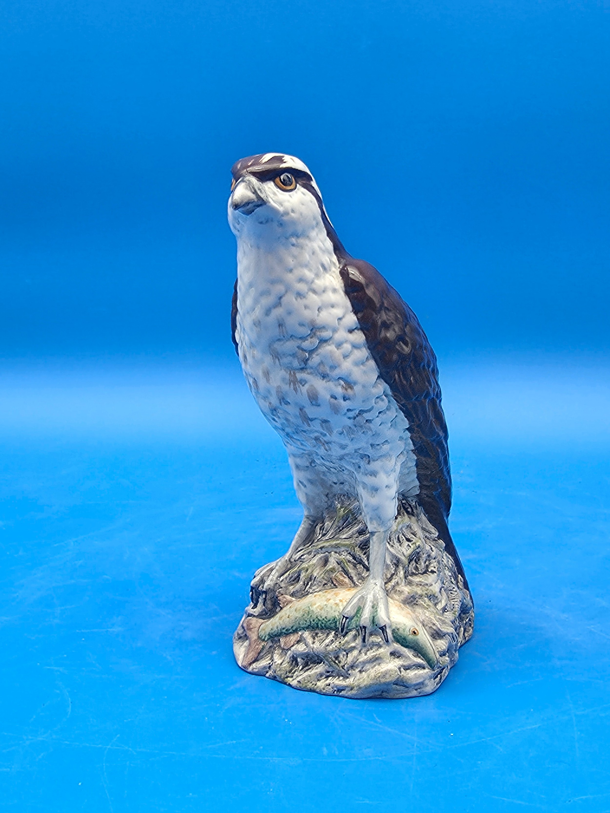 Beswick osprey ceramic Scotch whisky decanter with mottled brown wings, pale breast, and a rocky base
